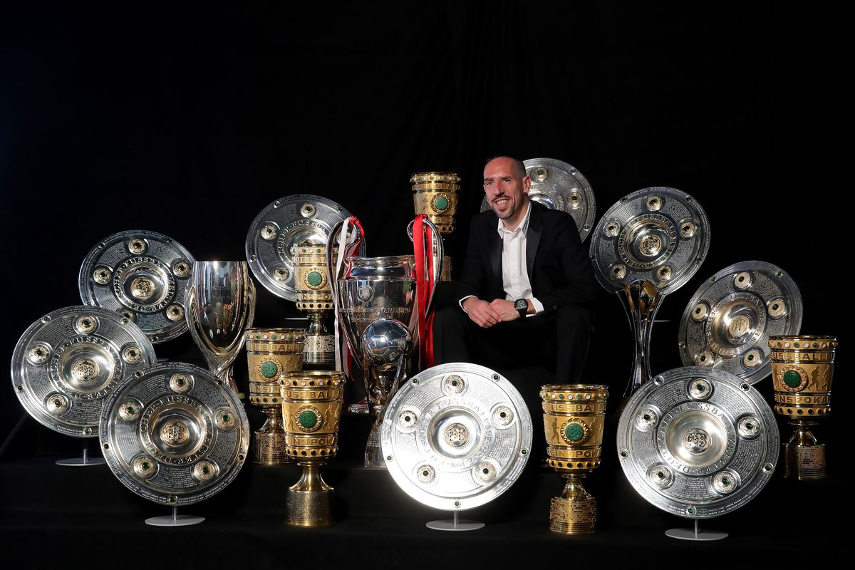 Arjen Robben And Franck Ribery Hand Over Championship And DFB Cup Trophy To FCB Erlebniswelt