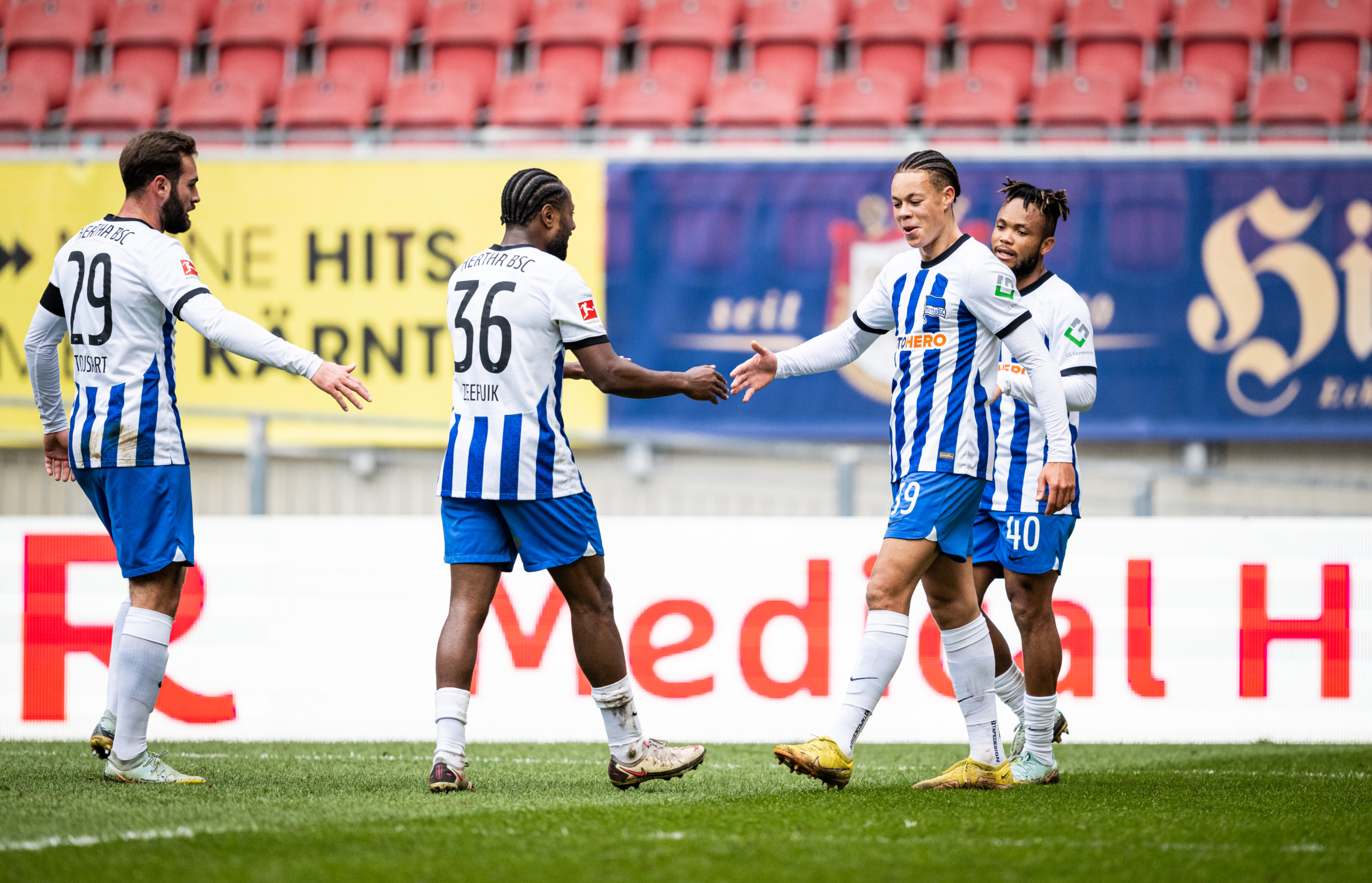 Derry Scherhant celebrates his equaliser with his teammates.