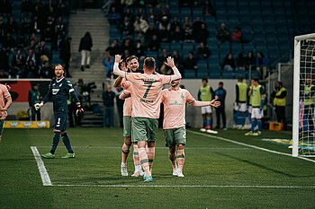 team celebrating a goal in hoffenheim