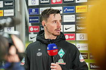 Marco Frield with a Sky microphone.