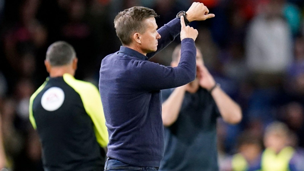 Leeds manager Jesse Marsch points to his watch.