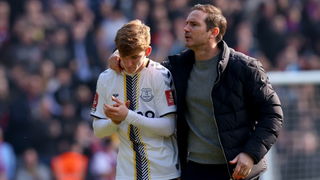 Everton midfielder Anthony Gordon gets a hug