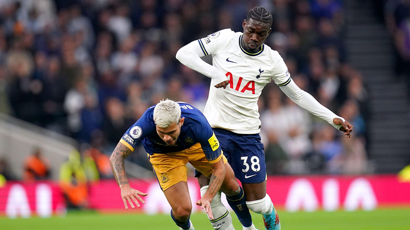 Bruno Guimaraes (left) and Tottenham Hotspur's Yves Bissouma battle for the ball