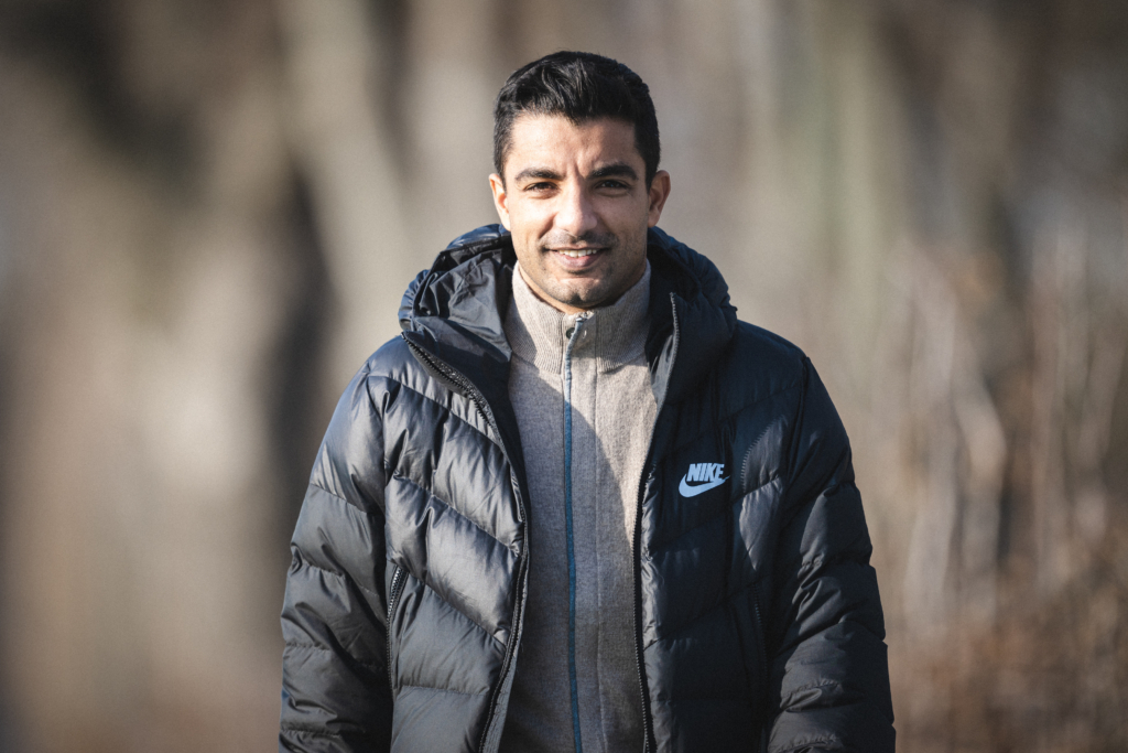 Sami Allagui walking smiling at Schenckendorffplatz.