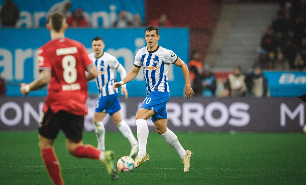 Marc Kempf drives forward with the ball.