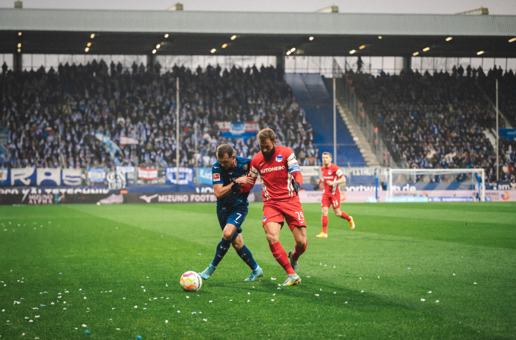 Lucas Tousart competes for the ball.