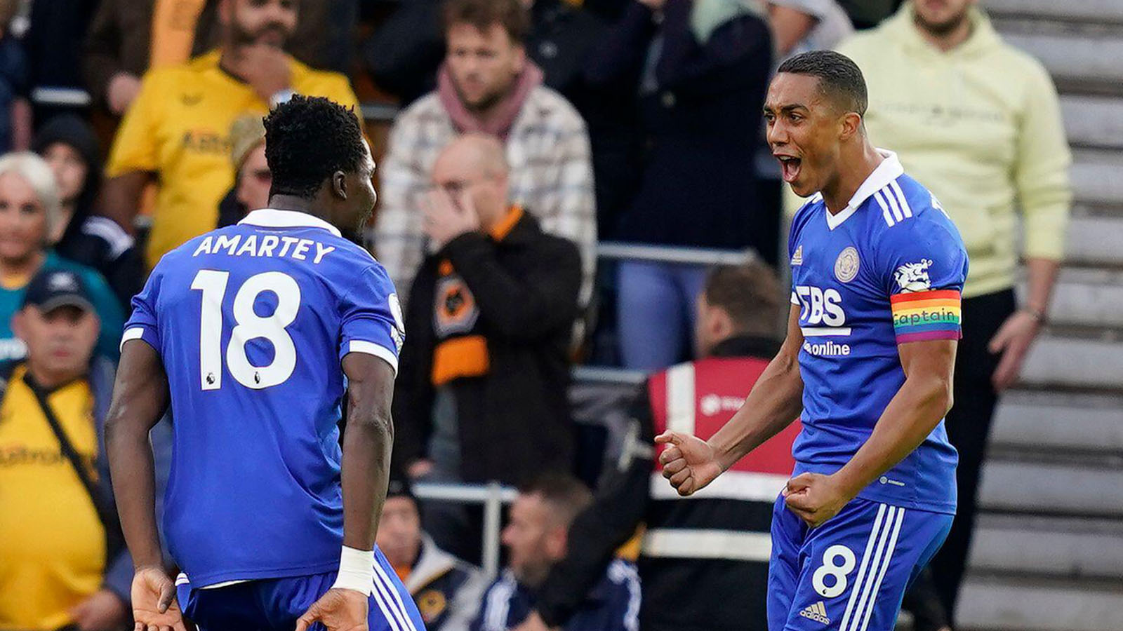 Youri Tielemans of Leicester City (R) celebrates after scoring the opening goal during