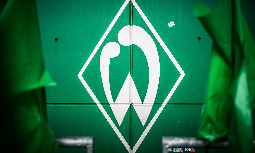 Werder's badge on a green wall in the Ostkurve.