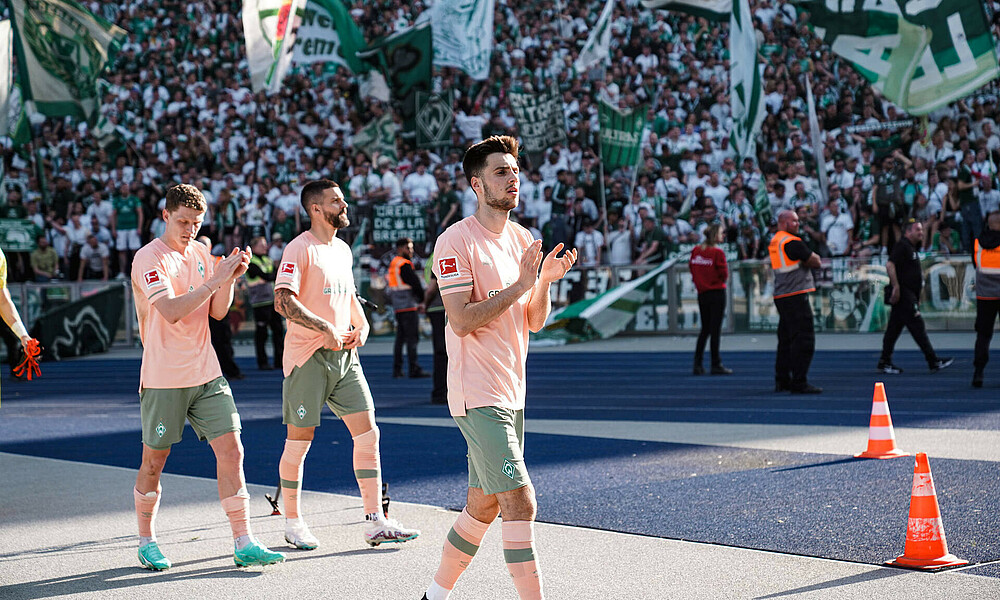 Ilia Gruev clapping at the away end in Berlin.