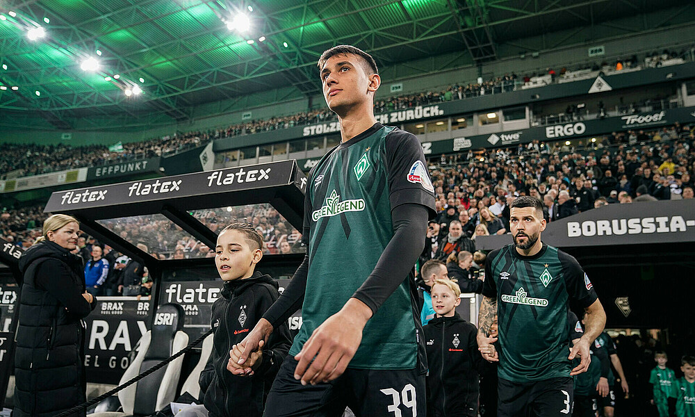 Fabio Chiarodia walking out onto the pitch.