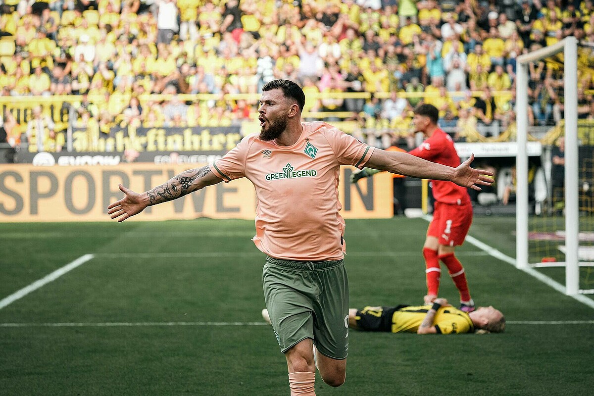 Oliver Burke celebrates his goal against Borussia Dortmund.