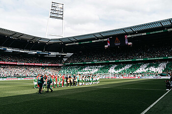 The teams lining up after the warm-up for the home game against 1. FC Köln