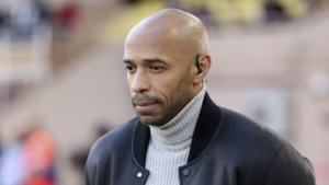 Arsenal legend Thierry Henry looks at the floor