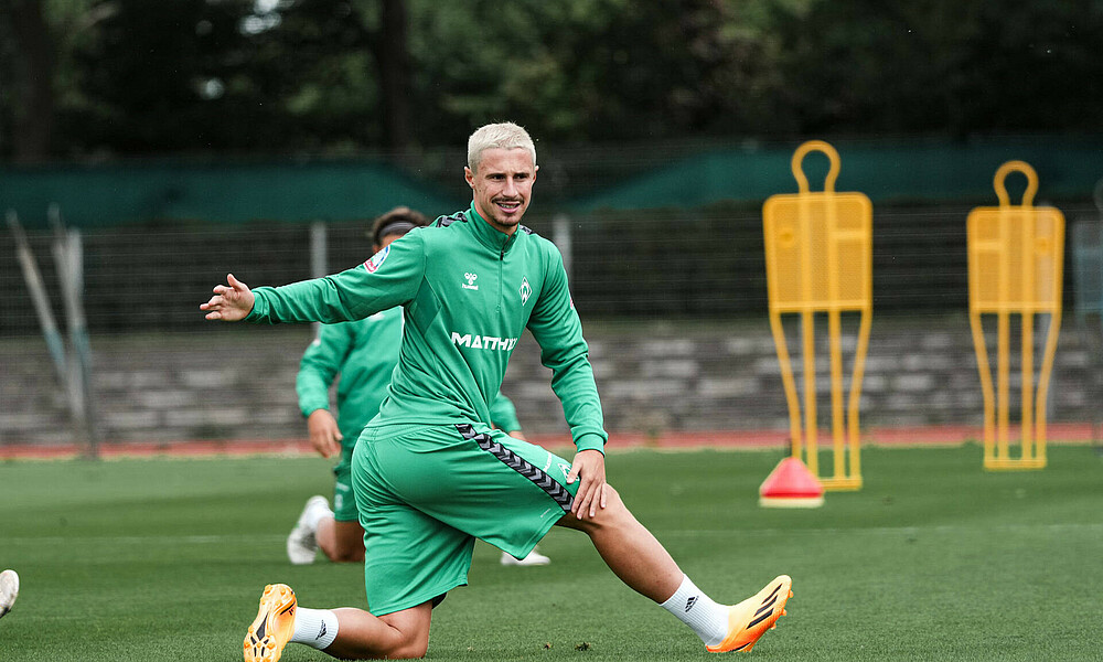 Marco Friedl stretching during training.