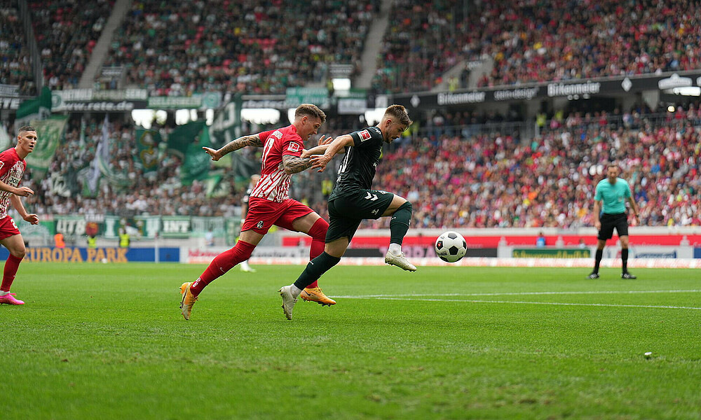 Schmid contesting a tackle.