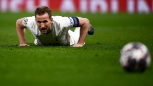 Spurs striker Harry Kane falls to the floor