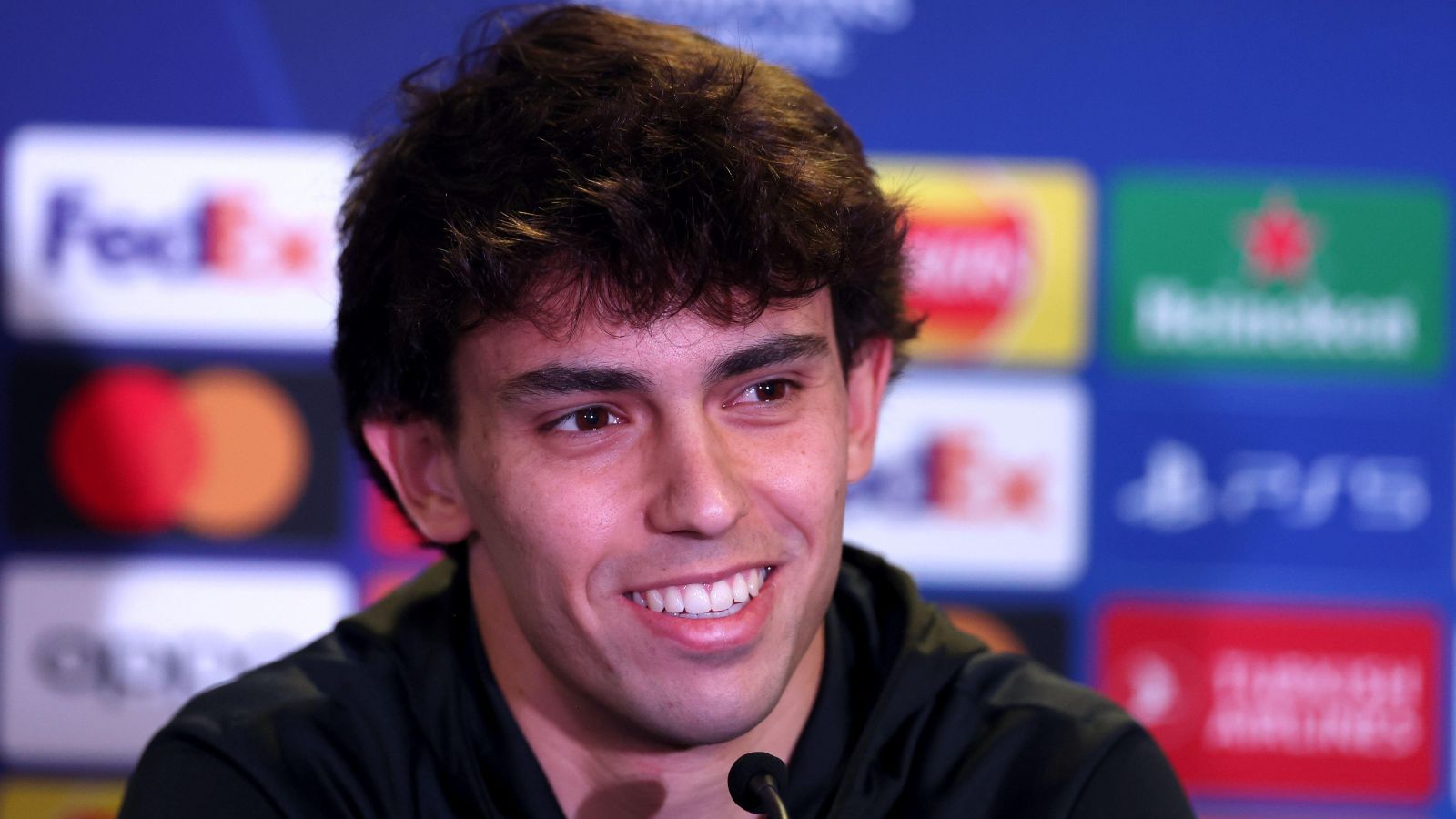 Joao Felix smiles during a press conference