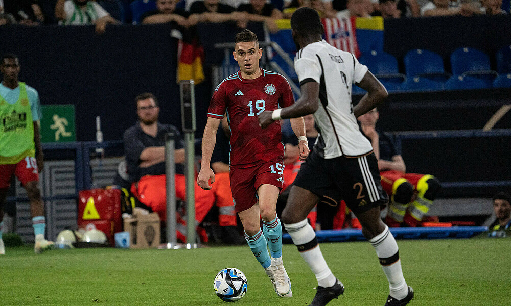 Rafael Borré on the ball for Colombia, Antonio Rüdiger is the defender.