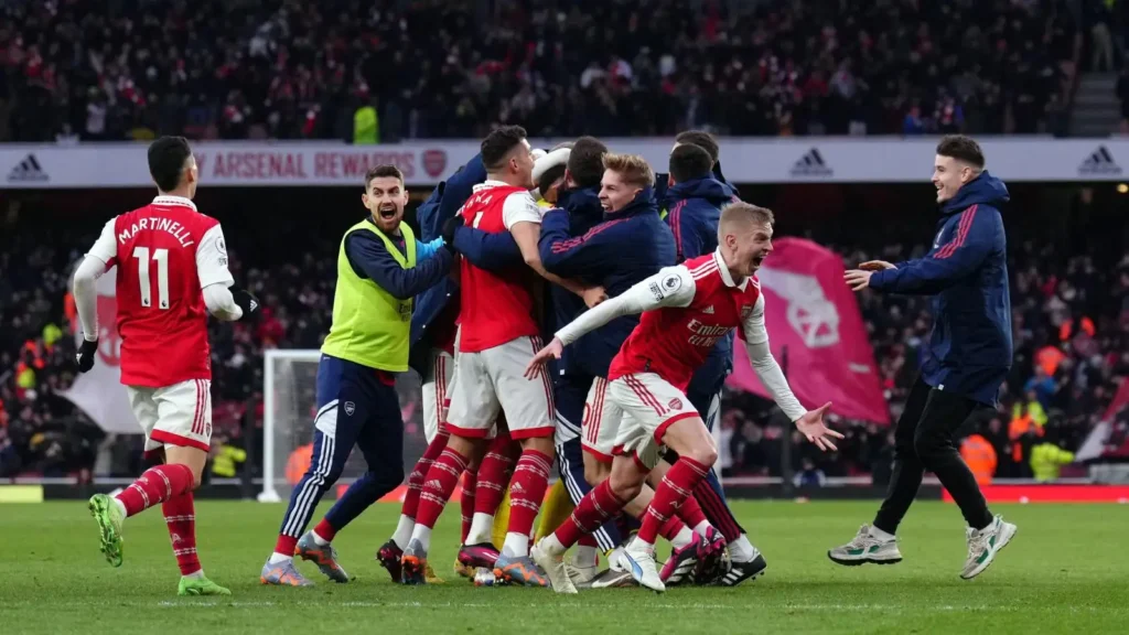 Arsenal players celebrate Reiss Nelson's last-minute goal