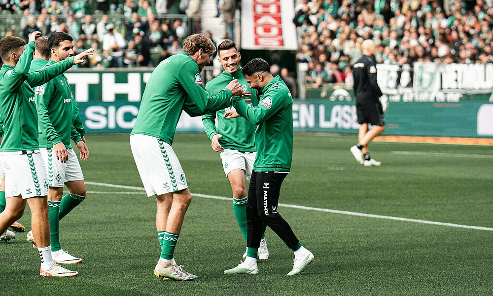 The SVW players celebrate the home win over Köln