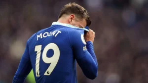 Chelsea midfielder Mason Mount wipes his face with his shirt