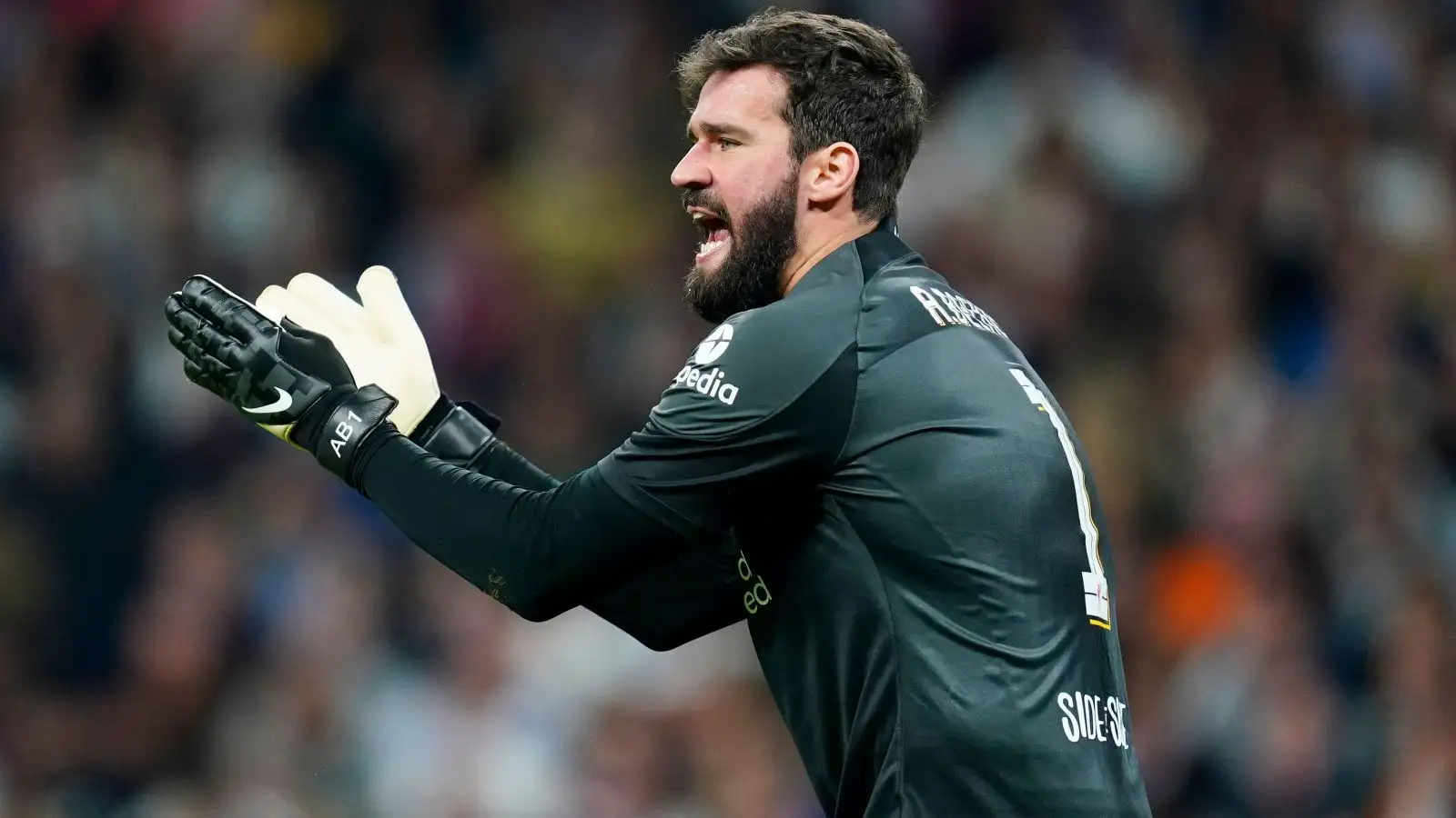 Alisson urges his teammates on