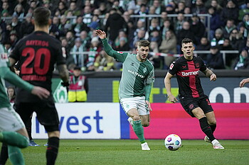 Romano Schmid tackling Granit Xhaka.