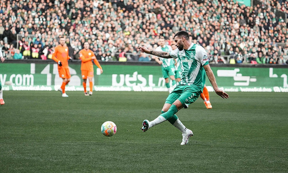 Anthony Jung kicking the ball.