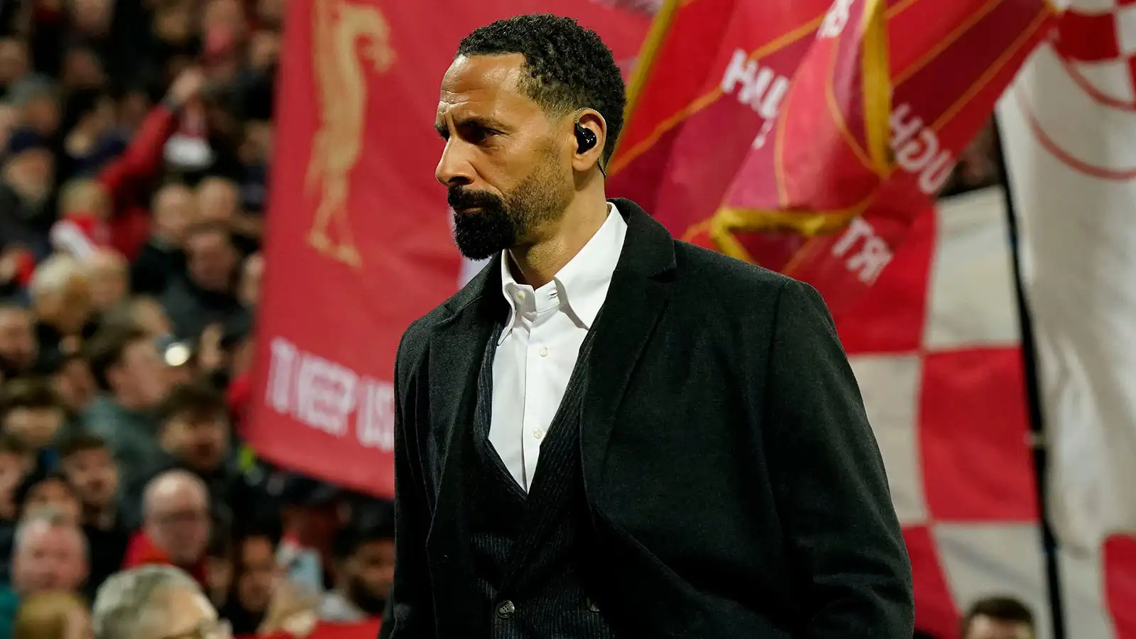 Liverpool, UK. 21st Feb, 2023. Former Manchester Utd player Rio Ferdinand walks in front of the Kop during the UEFA Champions League match at Anfield, Liverpool