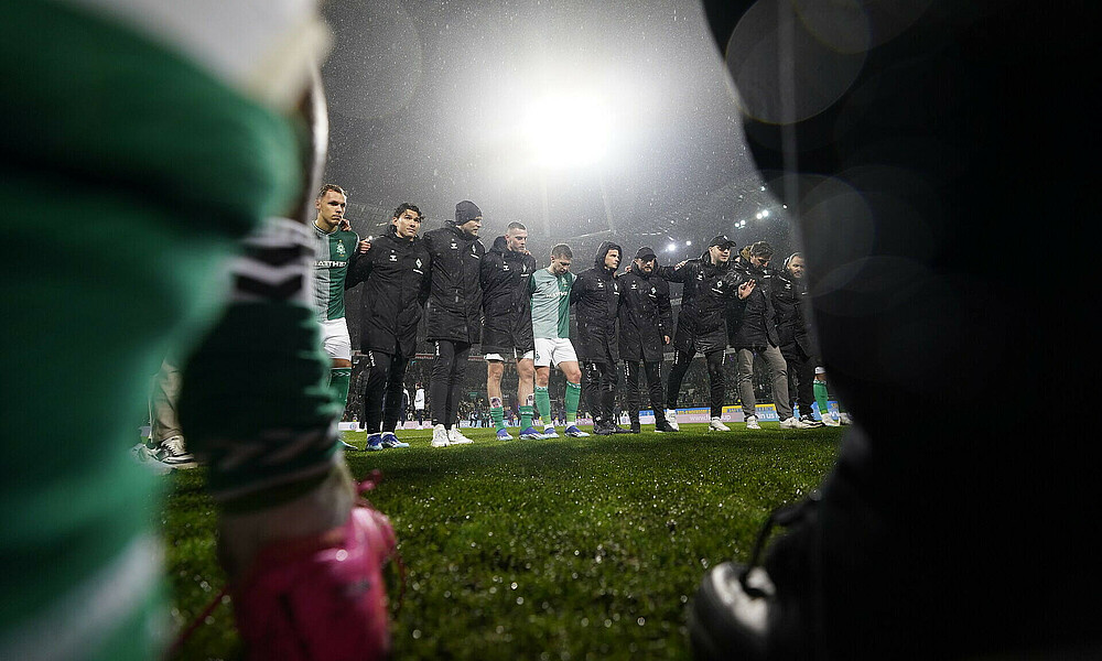 The team in a huddle.