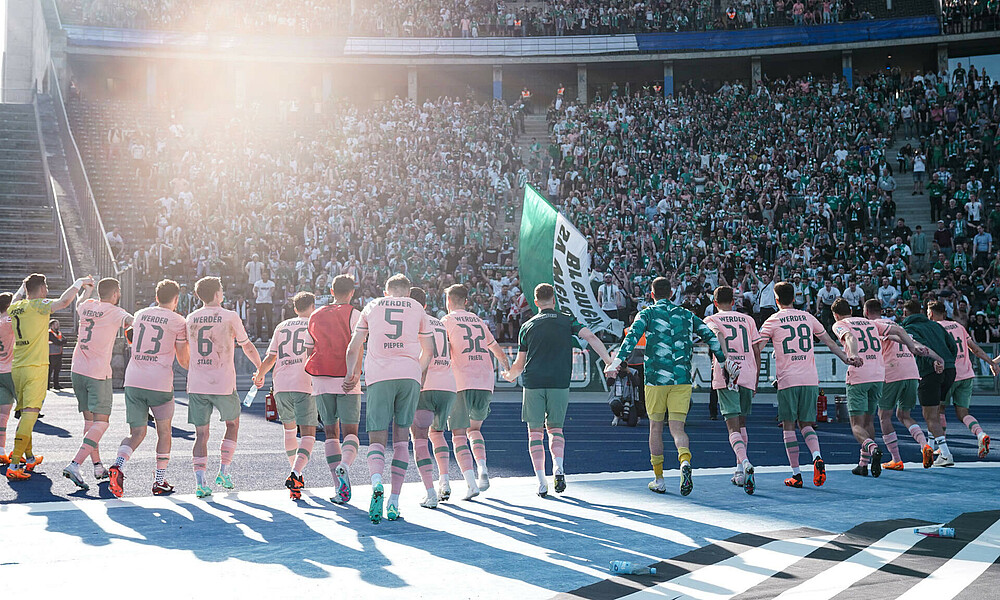 The team by the away stand at the Olympiastadion.