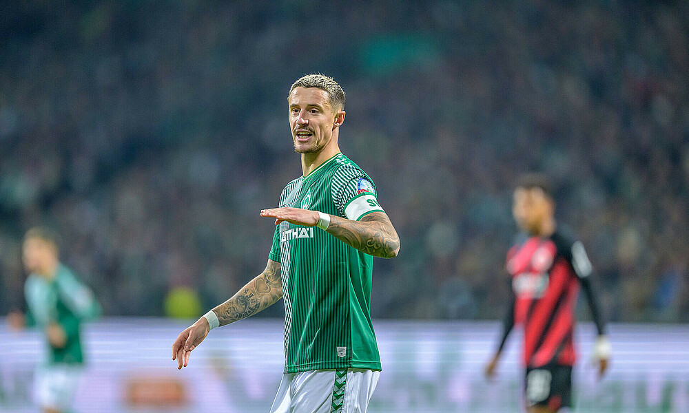 Marco Friedl gesturing with his arm during the game.