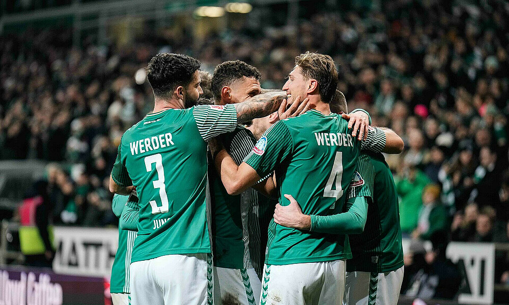 The team celebrating a goal against Augsburg.