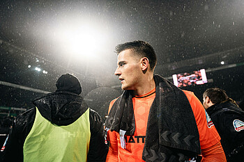 Michael Zetterer with floodlights in the background.