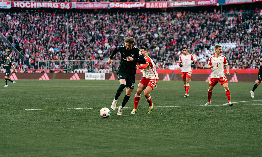 Nick Woltemade runs at the opposition goal with the ball at this feet.