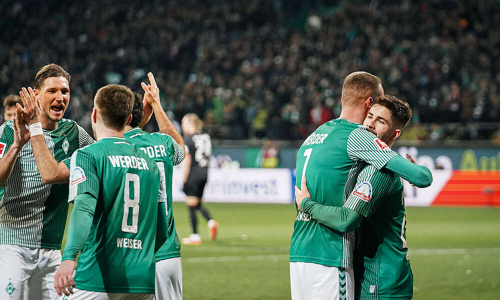 The team celebrate a goal against FC Augsburg.