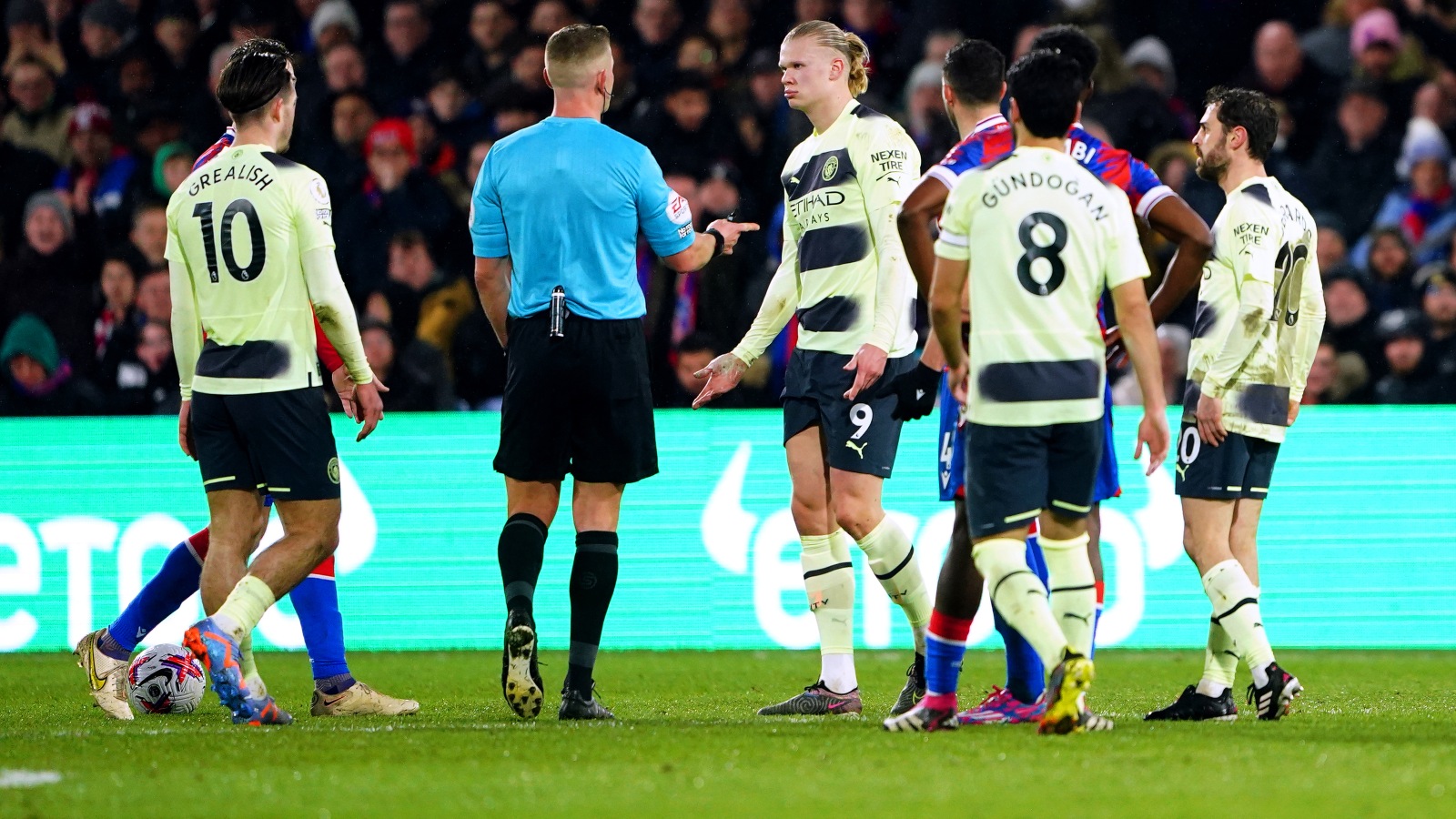 Erling Haaland talks to the referee during Manchester City's clash with Crystal Palace.