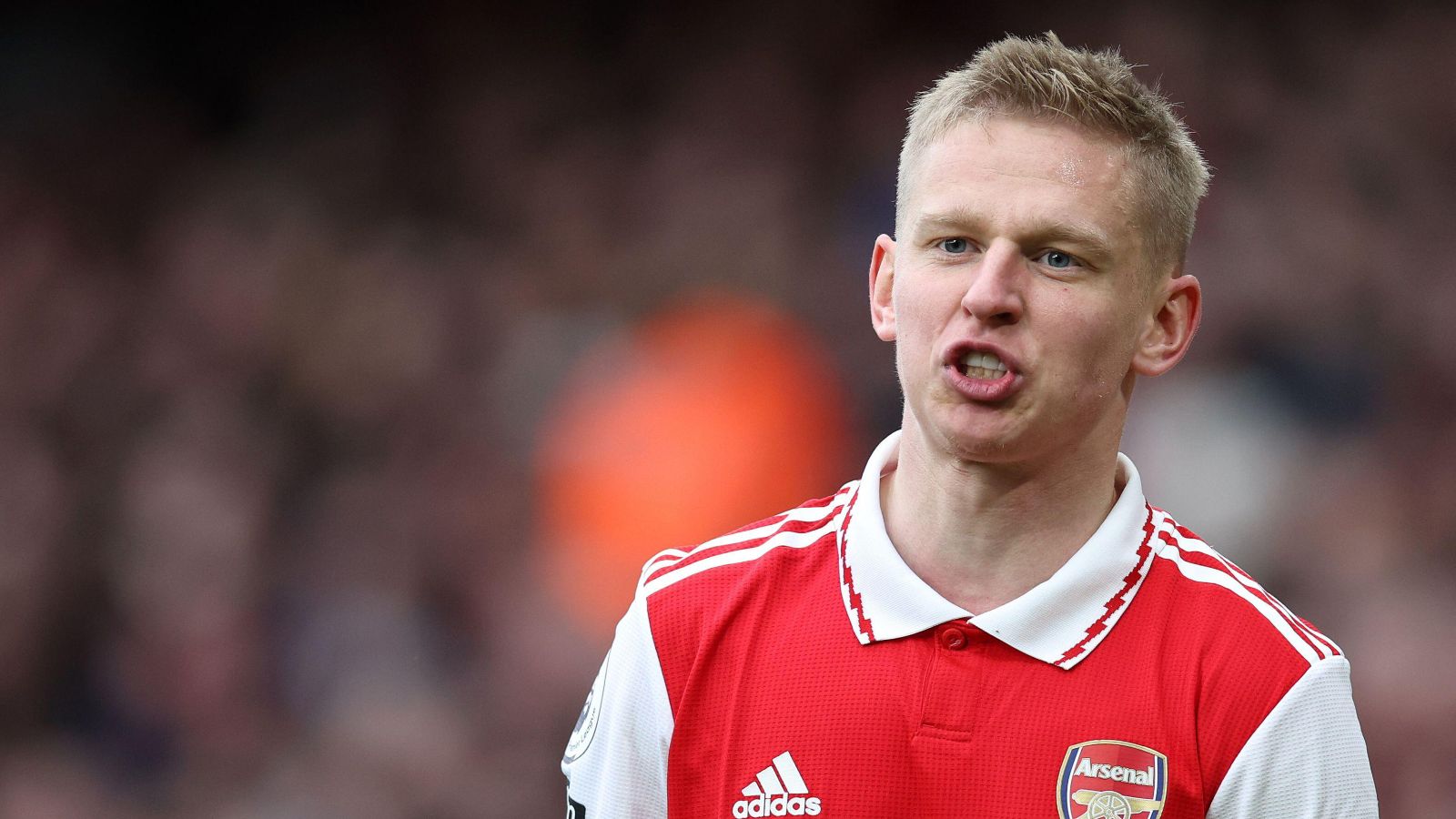 Arsenal defender Oleksandr Zinchenko shouts something at a team-mate