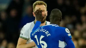Harry Kane is pushed in the face