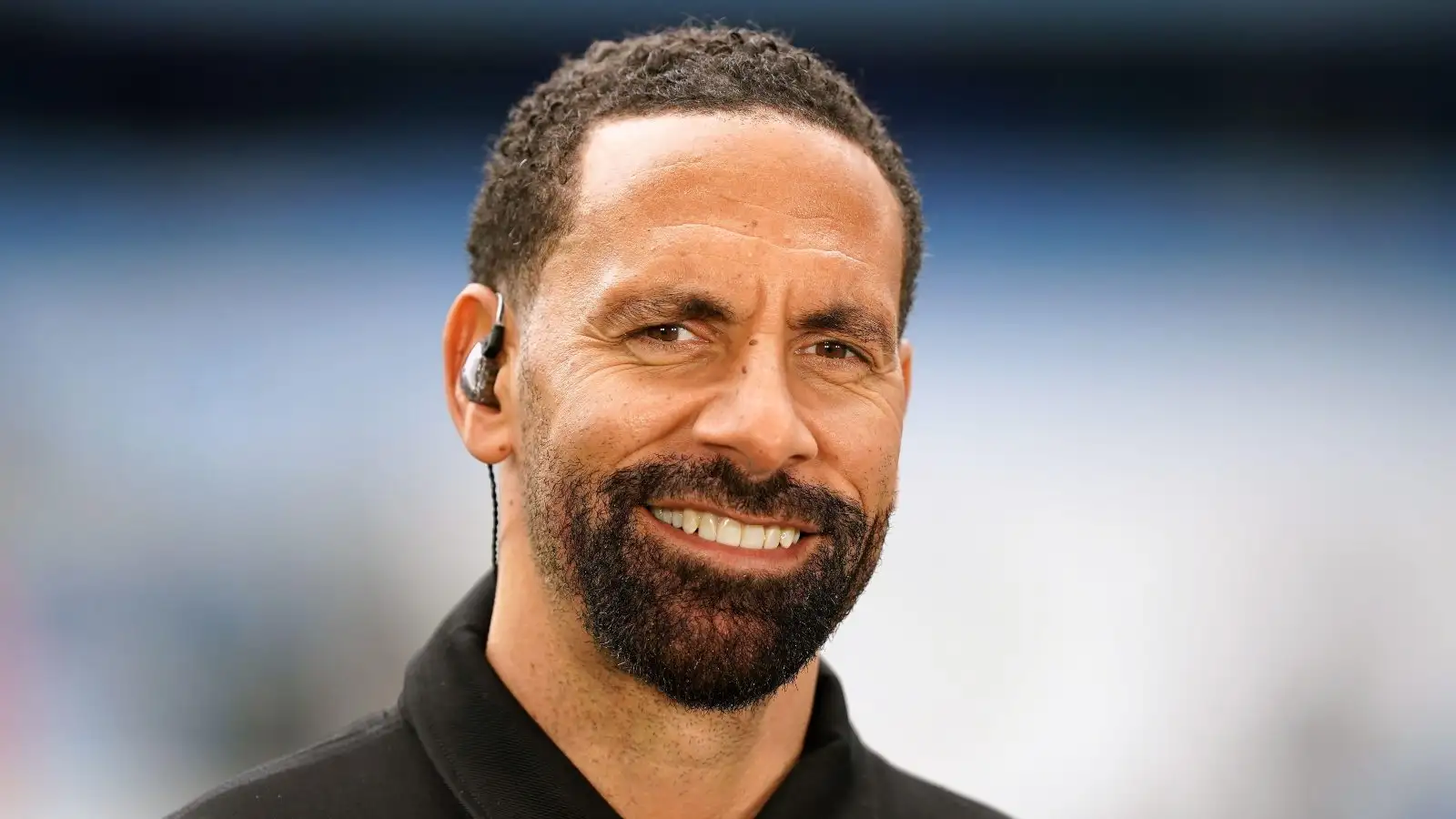 Man Utd legend Rio Ferdinand smiles