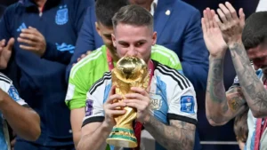 Liverpool target Alexis Mac Allister kisses the World Cup trophy
