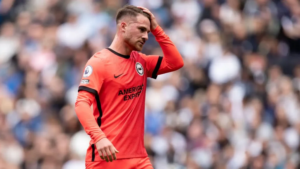 Liverpool target Alexis Mac Allister adjusts his hair