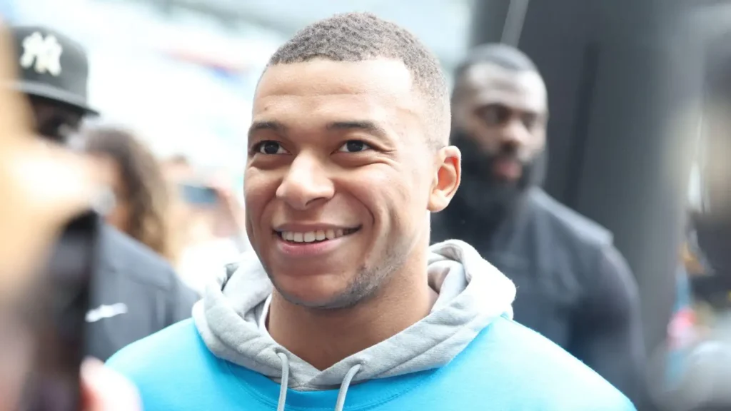 Chelsea target Kylian Mbappe smiles