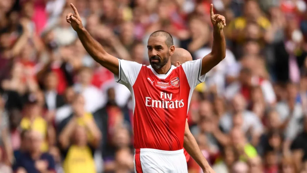 Arsenal winger Robert Pires salutes the crowd