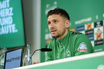 Milos Veljkovic speaking in the Mixed Zone.