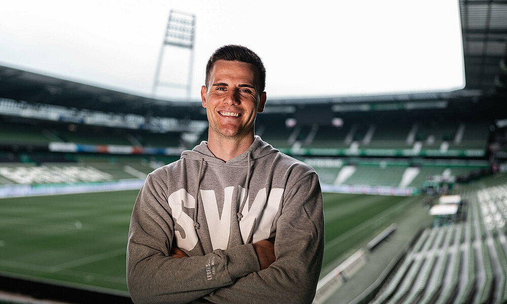 Michael Zetterer with crossed arms at the stadium.