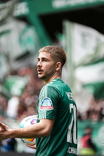 Romano Schmid prepares to take a throw-in.