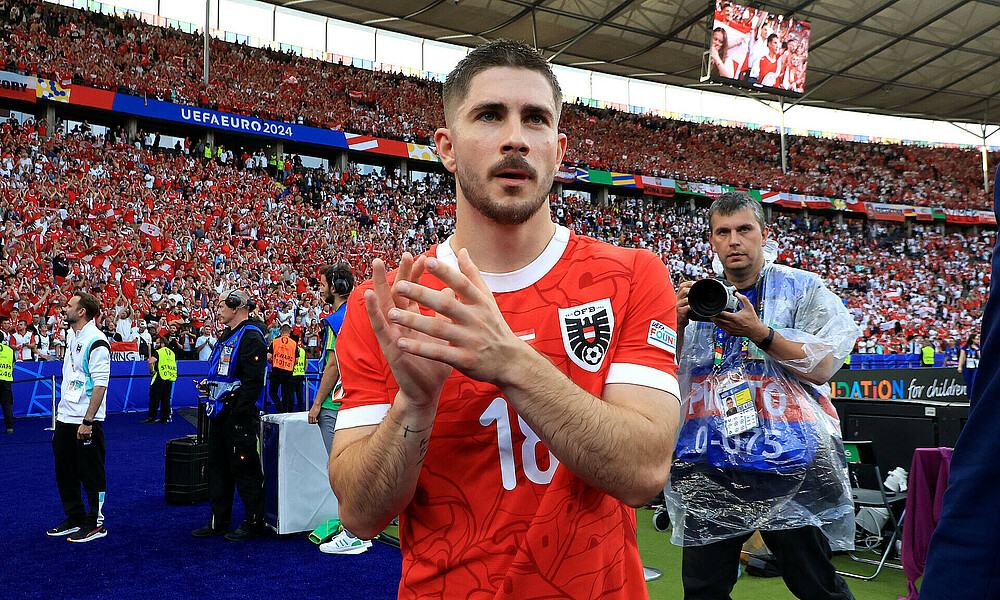 Romano Schmid celebrates after Austria's win over Poland.