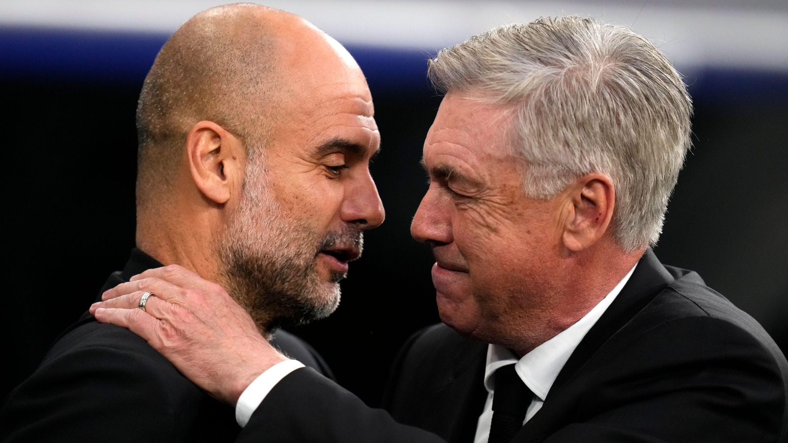 Man City manager Pep Guardiola greets Real Madrid coach Carlo Ancelotti.