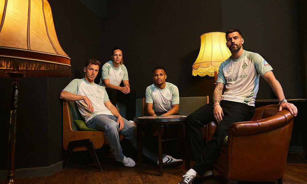 Werder players on armchairs in the new away kit.